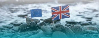 EU and UK flag on a beach